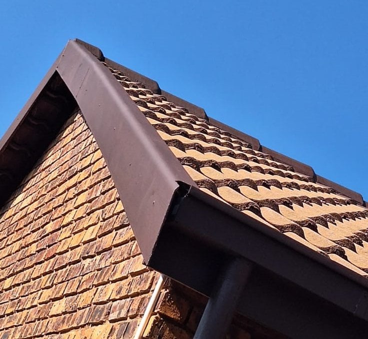 Fascia and barge boards installed along a roof edge